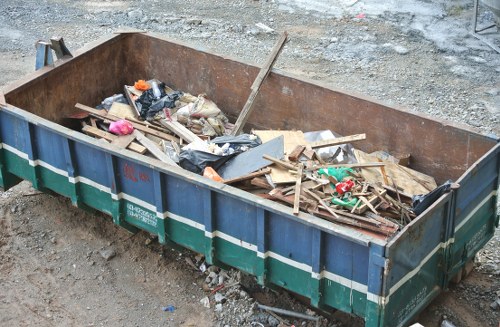 Company van delivering a skip at a residential property