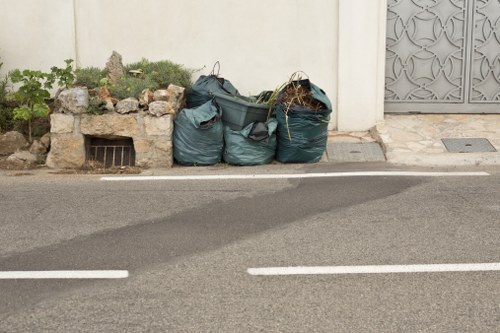 Skips and recycling signage in Stockwell street scene